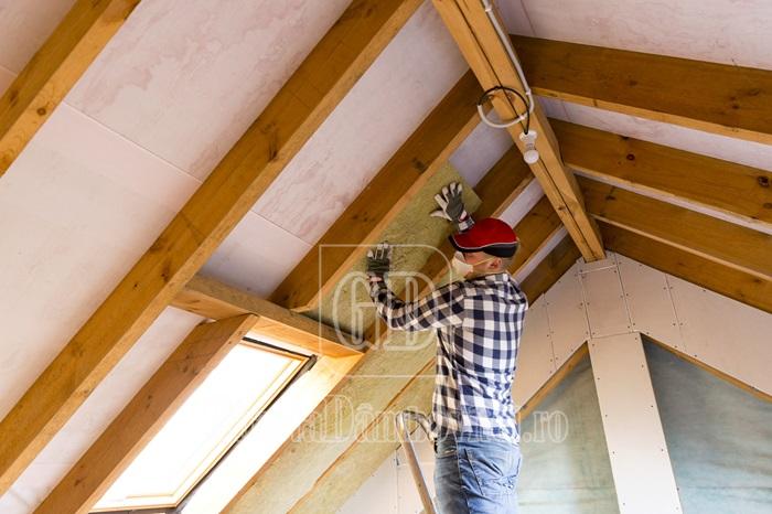 man,installing,thermal,roof,insulation,layer, ,using,mineral,wool