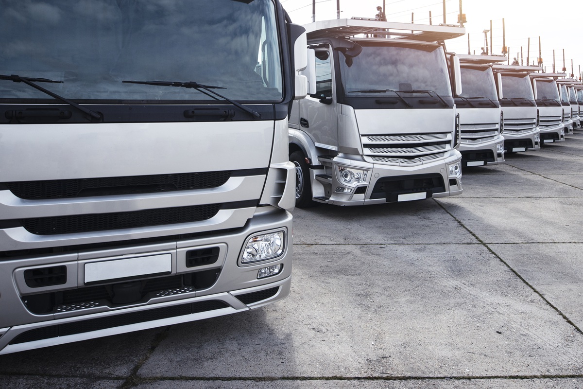 group of trucks parked in a row.