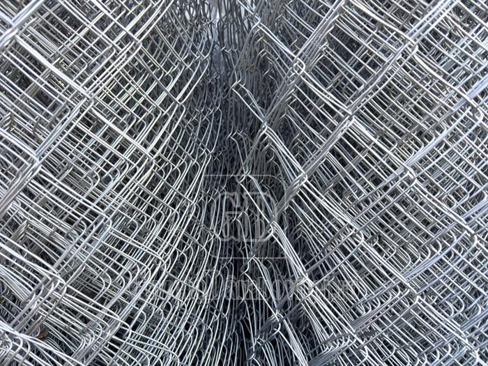 closeup,of,stacked,metal,wire,mesh,rolls,,showing,geometric,pattern