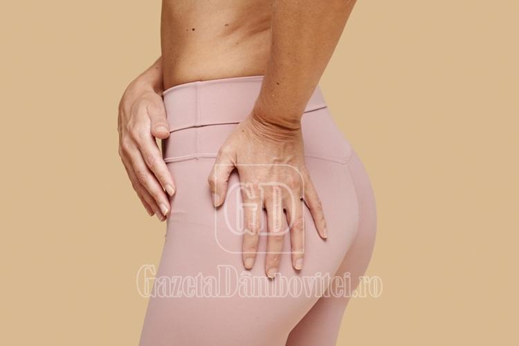 fit,woman,touching,her,tight,butt,in,pink,leggings