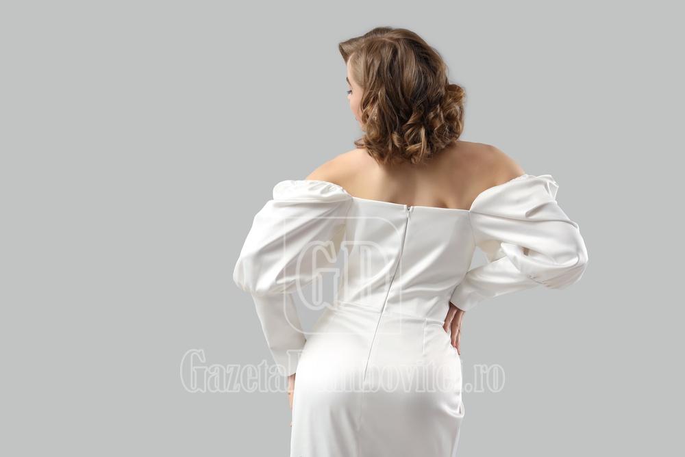 beautiful,bride,in,wedding,dress,on,light,background,,back,view