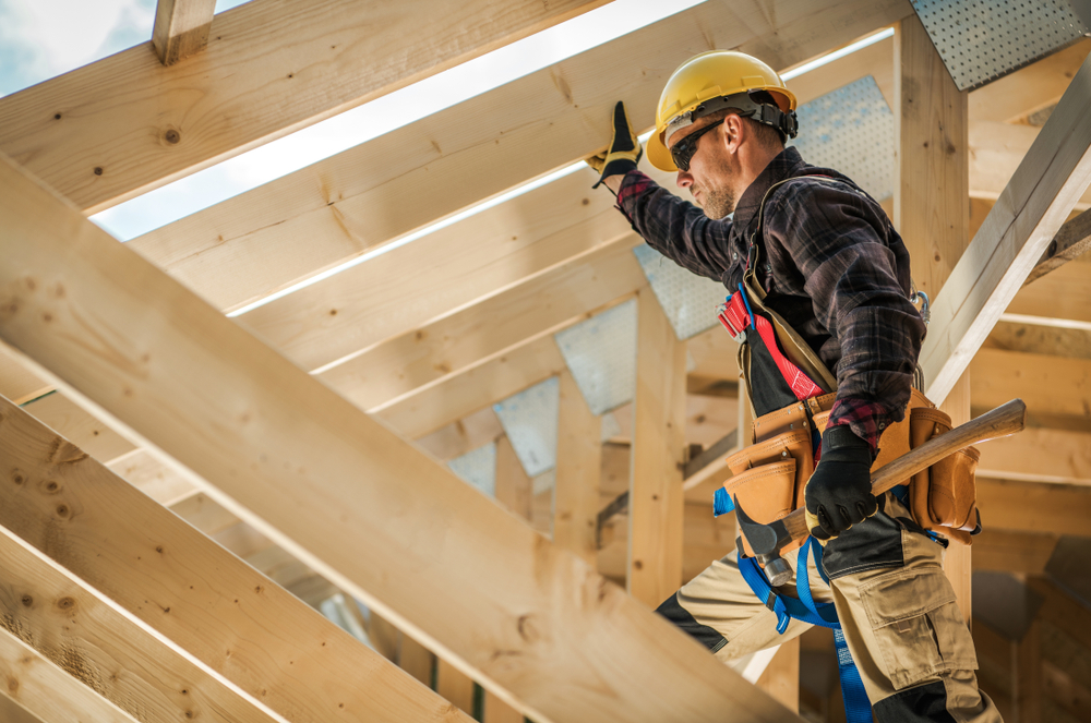 construction,worker,on,duty.,caucasian,contractor,and,the,wooden,house