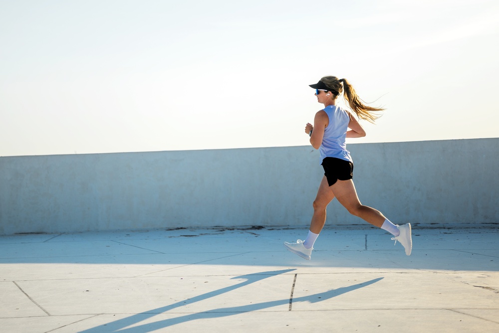 woman,runs,outdoors,on,a,sunny,day,on,a,rooftop